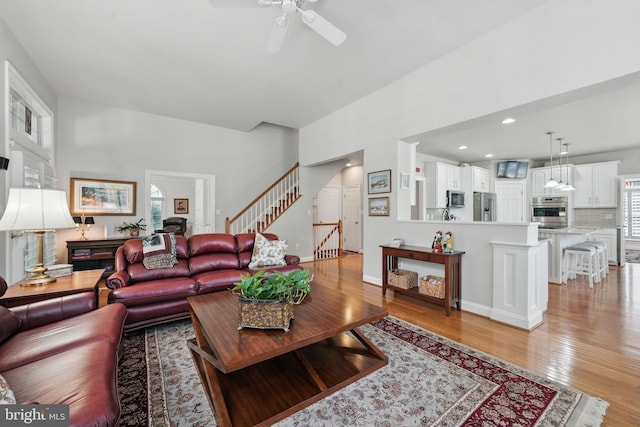 6321 Wilmington Dr, Burke, VA 22015 - living area with ceiling fan, light wood-style flooring, stairs, and recessed lighting