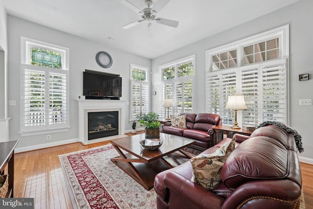 6321 Wilmington Dr, Burke, VA 22015 - living area featuring a ceiling fan, a fireplace with flush hearth, and wood finished floors