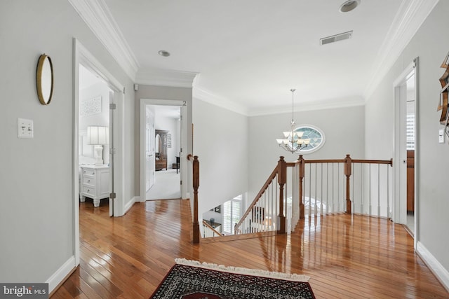 6321 Wilmington Dr, Burke, VA 22015 - corridor with an upstairs landing, hardwood / wood-style flooring, a chandelier, and ornamental molding