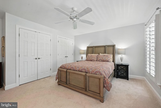 6321 Wilmington Dr, Burke, VA 22015 - bedroom with light carpet, multiple closets, and ceiling fan