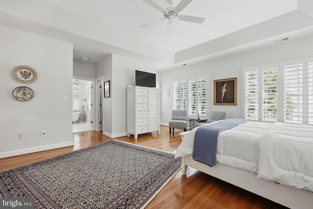 6321 Wilmington Dr, Burke, VA 22015 - bedroom with wood finished floors, a raised ceiling, and ceiling fan