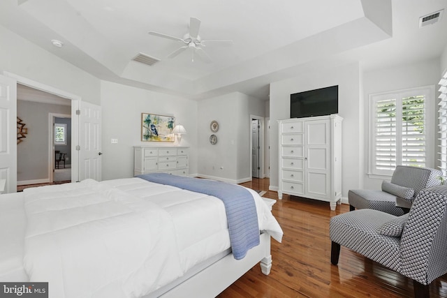 6321 Wilmington Dr, Burke, VA 22015 - bedroom with a raised ceiling, wood finished floors, and ceiling fan