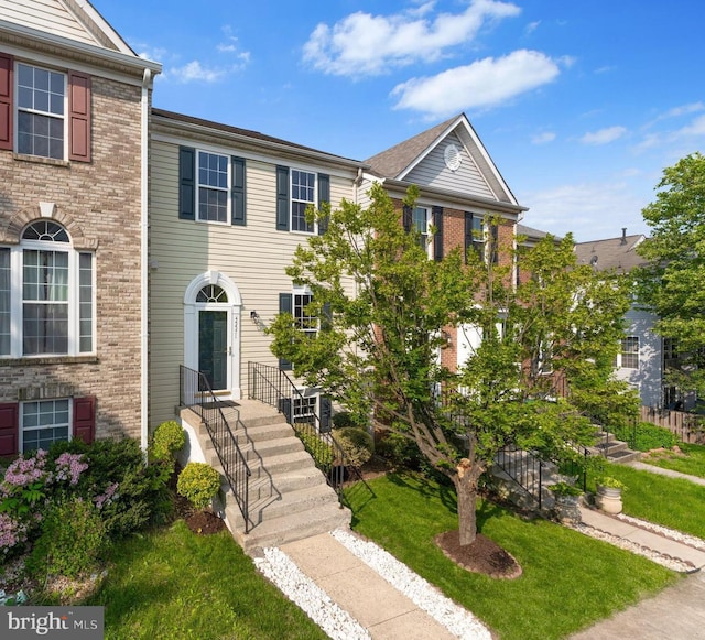 45571 Reading Ter, Sterling, VA 20166 - multi unit property featuring brick siding and a front yard