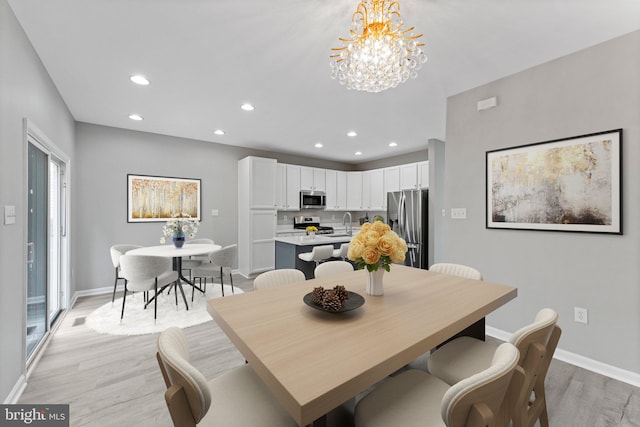 45571 Reading Ter, Sterling, VA 20166 - dining area featuring light wood-style flooring, recessed lighting, baseboards, and a chandelier