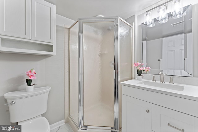 45571 Reading Ter, Sterling, VA 20166 - bathroom with toilet, vanity, a shower stall, and marble look tiles