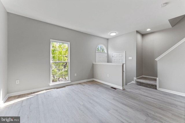 45571 Reading Ter, Sterling, VA 20166 - spare room featuring stairs, wood finished floors, baseboards, and recessed lighting