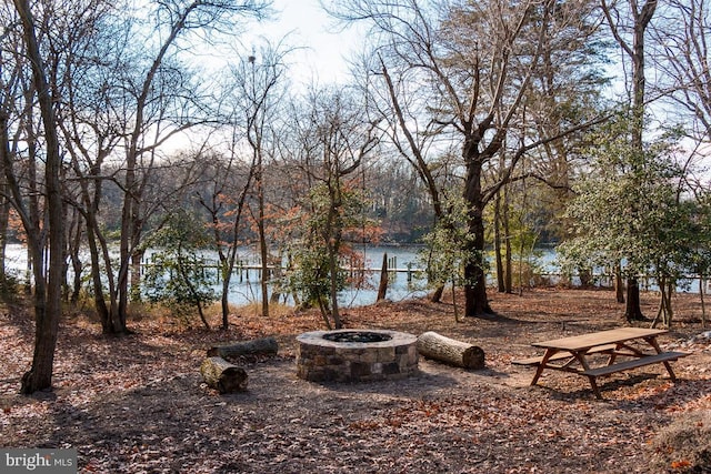 11 Inglenook Ct, Glen Burnie, MD 21060 - view of yard featuring an outdoor fire pit and a water view