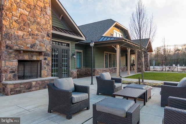 11 Inglenook Ct, Glen Burnie, MD 21060 - view of patio with an outdoor living space with a fireplace and french doors