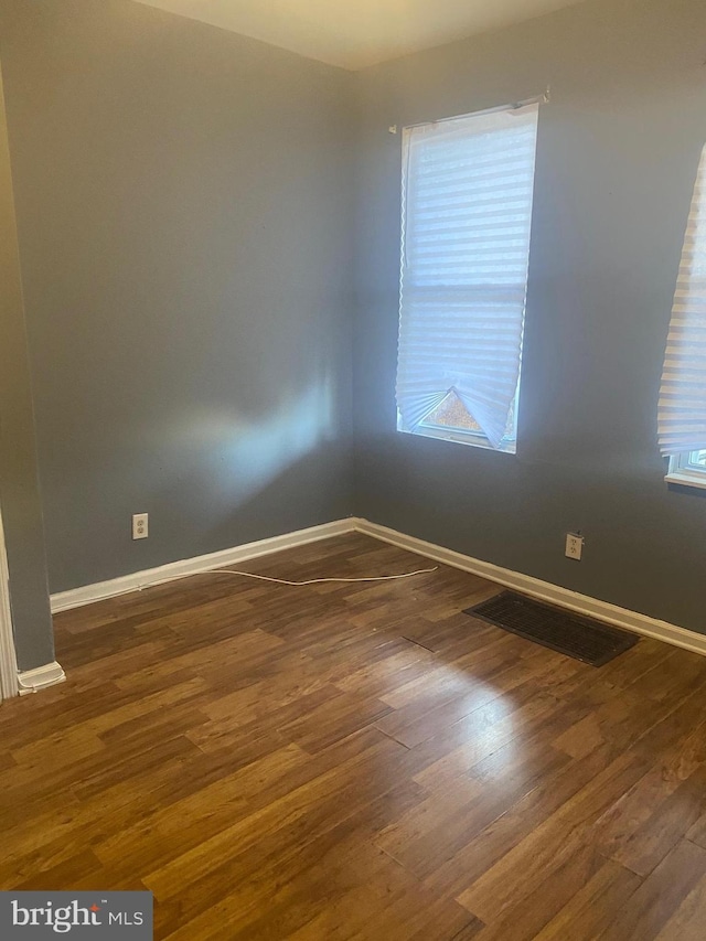 2919 Baker St, Baltimore, MD 21216 - unfurnished room featuring wood finished floors and baseboards