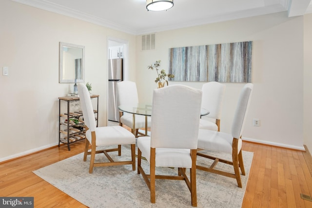 3134 Borge St, Oakton, VA 22124 - dining area with crown molding and wood finished floors