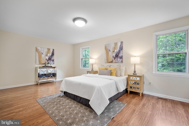 3134 Borge St, Oakton, VA 22124 - bedroom featuring wood finished floors and baseboards