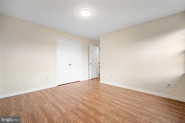 3134 Borge St, Oakton, VA 22124 - unfurnished bedroom with light wood-style flooring and a closet