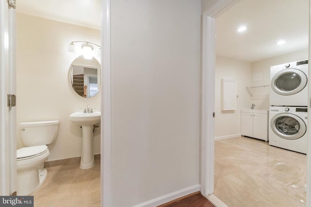 3134 Borge St, Oakton, VA 22124 - half bathroom featuring stacked washer / drying machine and recessed lighting