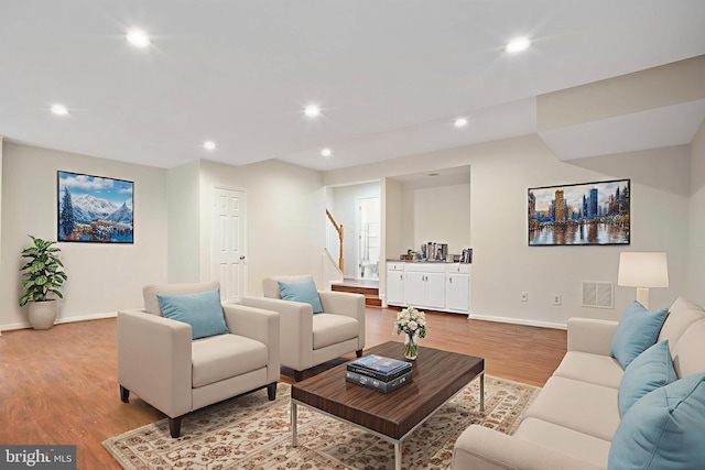 3134 Borge St, Oakton, VA 22124 - living area with stairs, wood finished floors, and recessed lighting