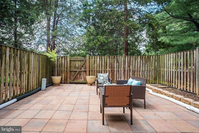 3134 Borge St, Oakton, VA 22124 - fenced backyard with a gate and a patio area