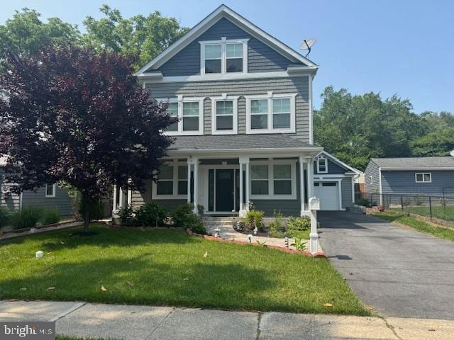 3112 Lancer Dr, Hyattsville, MD 20782 - view of front facade with a garage and asphalt driveway