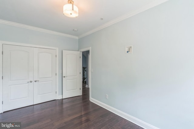 3112 Lancer Dr, Hyattsville, MD 20782 - unfurnished bedroom with ornamental molding, dark wood finished floors, and a closet
