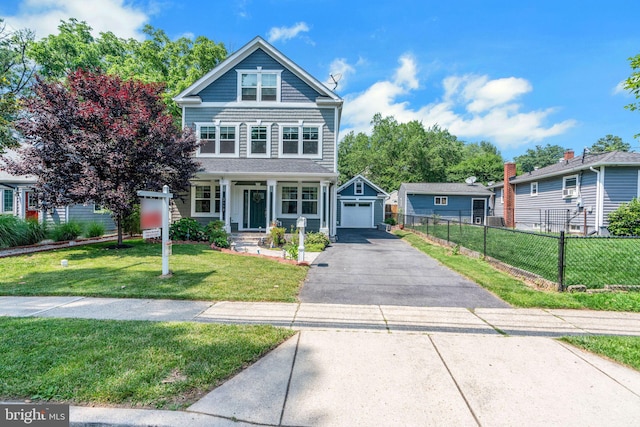 3112 Lancer Dr, Hyattsville, MD 20782 - view of front facade featuring asphalt driveway, a garage, and an outbuilding