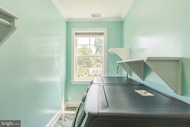 3112 Lancer Dr, Hyattsville, MD 20782 - laundry area with ornamental molding and washing machine and clothes dryer