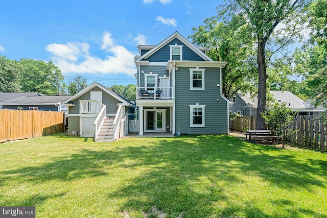 3112 Lancer Dr, Hyattsville, MD 20782 - back of house with a fenced backyard, stairway, a balcony, and a deck