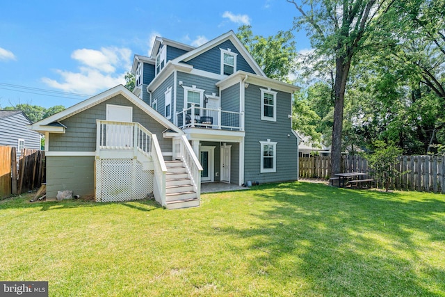 3112 Lancer Dr, Hyattsville, MD 20782 - back of house with a fenced backyard, stairs, and a wooden deck