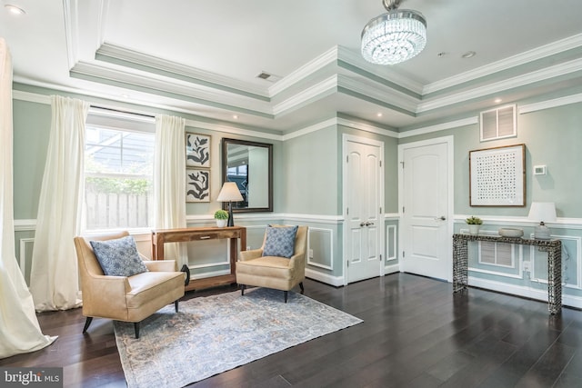 3112 Lancer Dr, Hyattsville, MD 20782 - sitting room featuring a tray ceiling, a decorative wall, a chandelier, crown molding, and wood finished floors