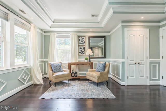 3112 Lancer Dr, Hyattsville, MD 20782 - sitting room featuring ornamental molding, a raised ceiling, wood finished floors, a decorative wall, and wainscoting