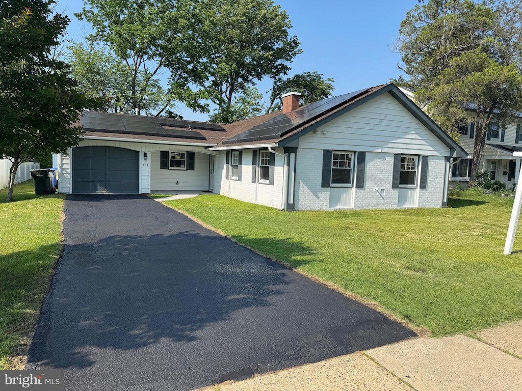 151 Pageant Ln, Willingboro, NJ 08046 - single story home with a garage, driveway, a front lawn, and brick siding
