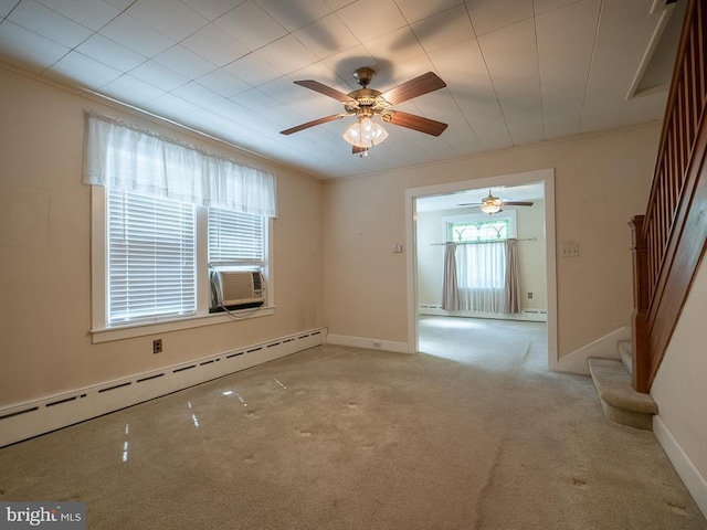 1947 Fairview Ave, Reading, PA 19606 - spare room featuring a baseboard heating unit, a ceiling fan, stairway, light colored carpet, and baseboards