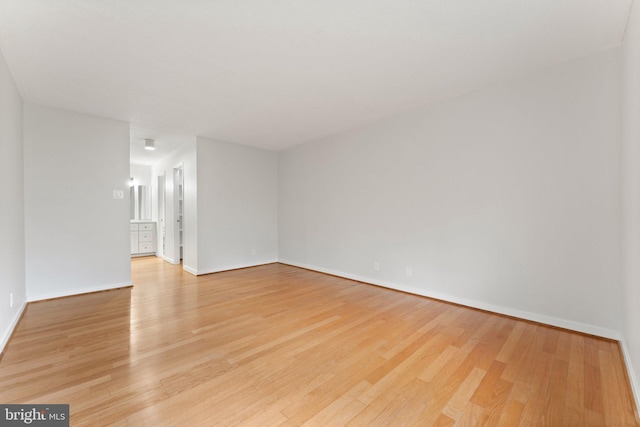 203 Yoakum Pkwy Unit 603, Alexandria, VA 22304 - unfurnished room with light wood-style floors and baseboards