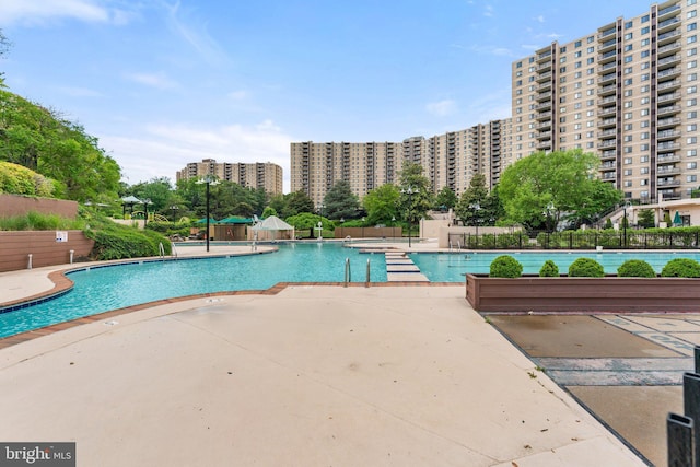 203 Yoakum Pkwy Unit 603, Alexandria, VA 22304 - community pool featuring a patio area and a city view
