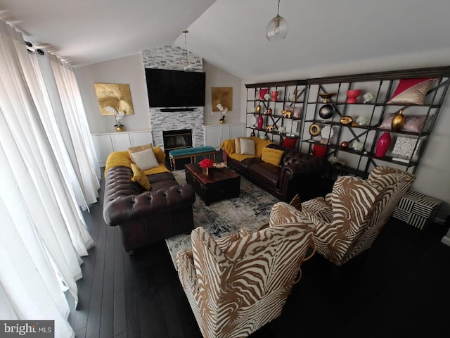 13017 Broadmore, Silver Spring, MD 20904 - living room with wainscoting, lofted ceiling, hardwood / wood-style flooring, and a large fireplace