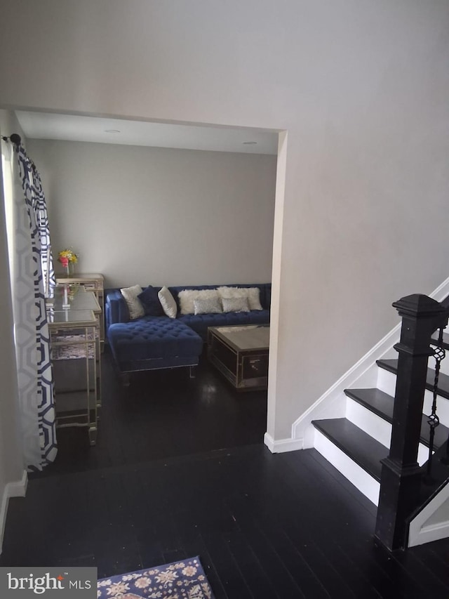 13017 Broadmore, Silver Spring, MD 20904 - living area with wood finished floors, baseboards, and stairway