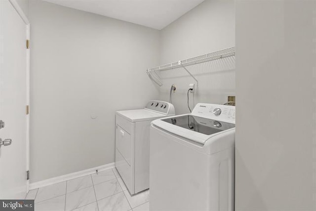 13017 Broadmore, Silver Spring, MD 20904 - laundry room with washer and dryer, baseboards, and light marble finish floors