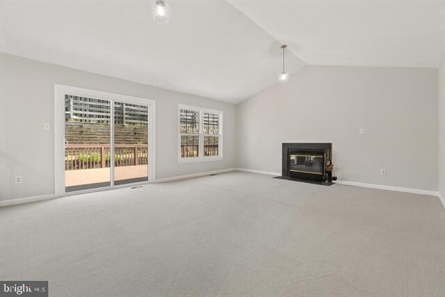 13017 Broadmore, Silver Spring, MD 20904 - unfurnished living room featuring carpet flooring, vaulted ceiling, a fireplace with flush hearth, and baseboards