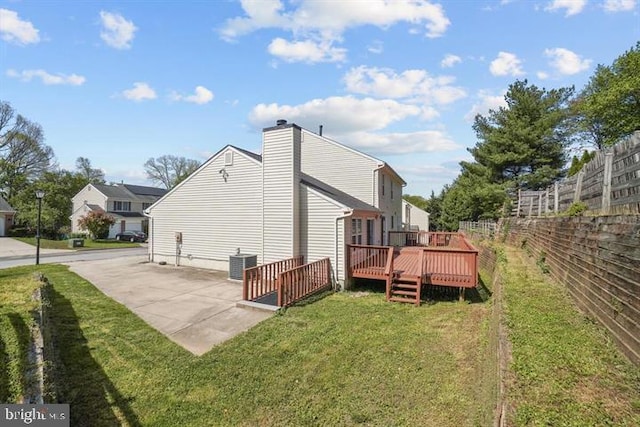13017 Broadmore, Silver Spring, MD 20904 - back of house with cooling unit, a wooden deck, a chimney, and a patio area