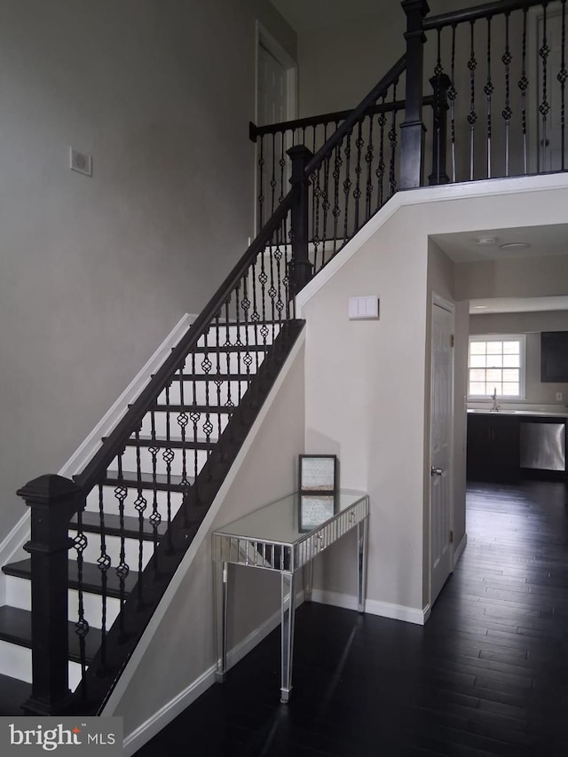 13017 Broadmore, Silver Spring, MD 20904 - stairs featuring baseboards, wood finished floors, and a high ceiling
