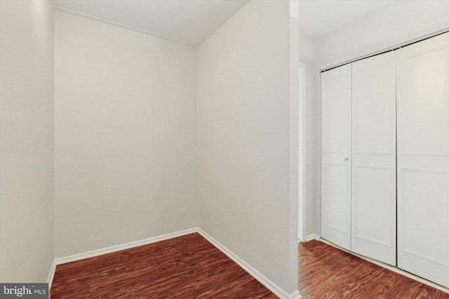 212 Old Forge Xing, Devon, PA 19333 - unfurnished bedroom featuring dark wood-style flooring and a closet