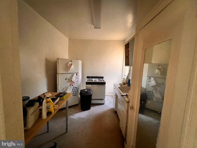 5427 Baltimore Ave, Philadelphia, PA 19143 - kitchen with white appliances and carpet floors