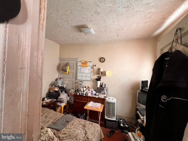 5427 Baltimore Ave, Philadelphia, PA 19143 - bedroom featuring a textured ceiling and wood finished floors