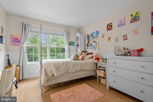 48 Deer Run Rd, Perkasie, PA 18944 - bedroom featuring a wainscoted wall and light wood-style floors