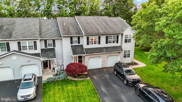 48 Deer Run Rd, Perkasie, PA 18944 - view of property featuring driveway, stone siding, a front lawn, and roof with shingles