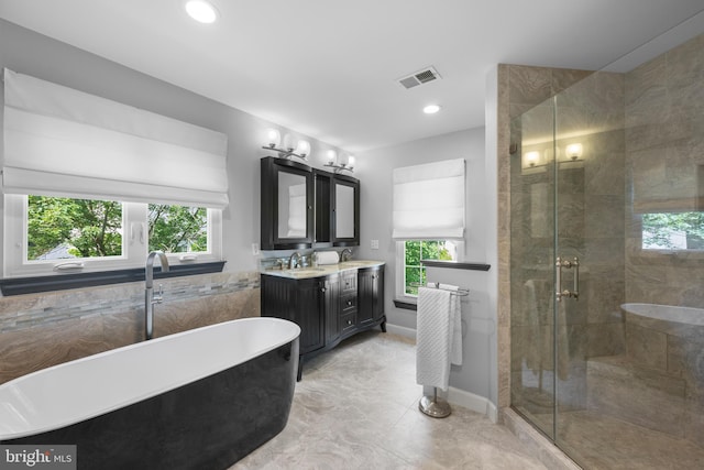 18722 Timoney Ct, Leesburg, VA 20176 - bathroom with vanity, a soaking tub, a stall shower, recessed lighting, and baseboards