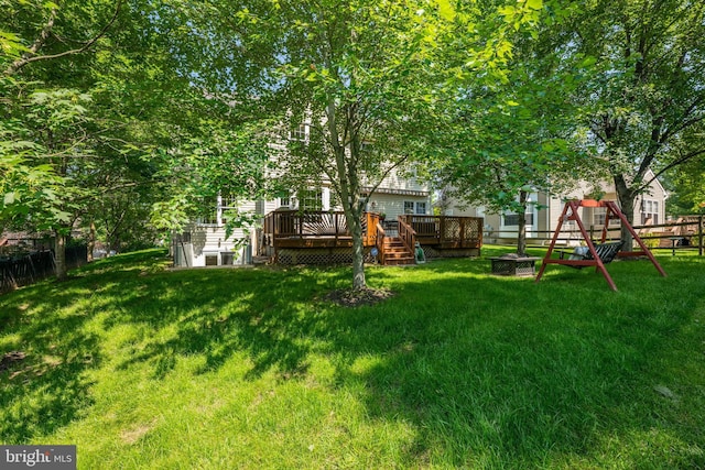 18722 Timoney Ct, Leesburg, VA 20176 - view of yard with a wooden deck and a playground