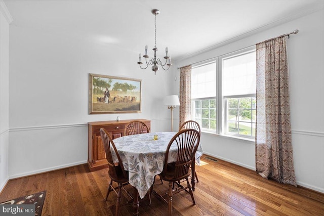 100 Taylor Ct, Stephenson, VA 22656 - dining room featuring a chandelier, wood finished floors, and crown molding