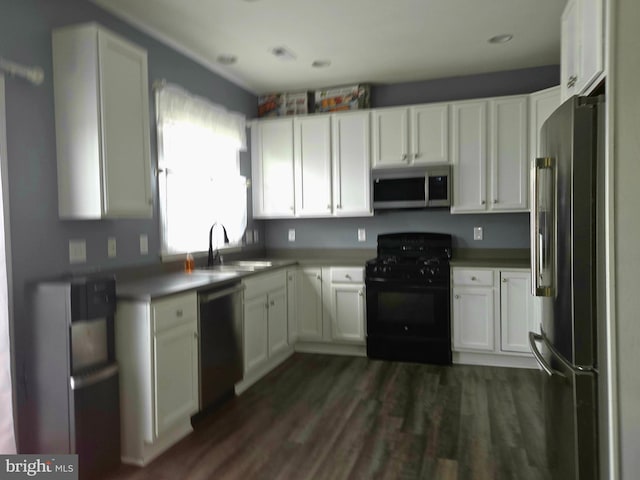 34 Springfield Cir, Middletown, DE 19709 - kitchen featuring appliances with stainless steel finishes, white cabinetry, and dark wood-style flooring