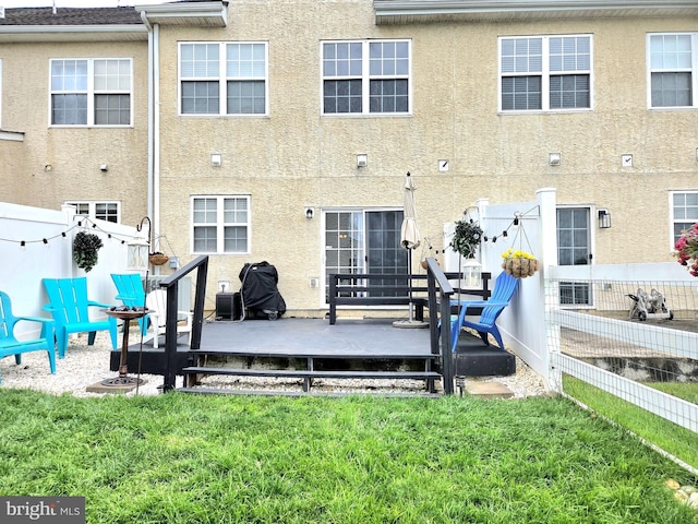 34 Springfield Cir, Middletown, DE 19709 - back of property featuring stucco siding and a deck