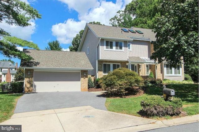 11409 Flints Grove Ln, North Potomac, MD 20878 - view of front of house featuring driveway, brick siding, and a garage