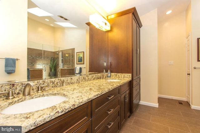11409 Flints Grove Ln, North Potomac, MD 20878 - full bath with double vanity, a skylight, a tile shower, baseboards, and recessed lighting