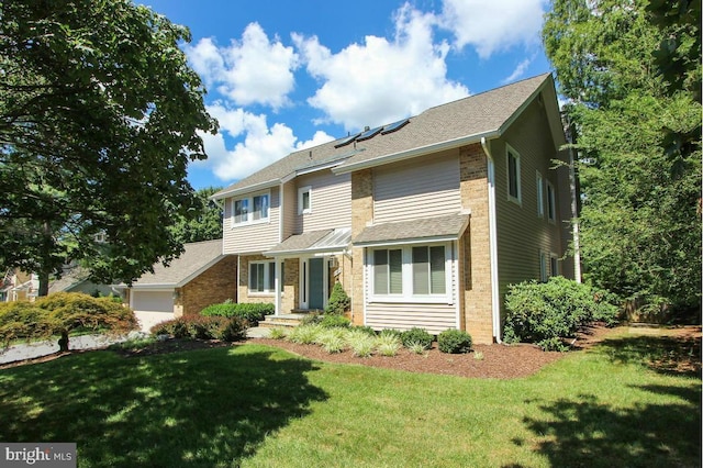 11409 Flints Grove Ln, North Potomac, MD 20878 - view of front facade with a front yard, a garage, and brick siding